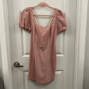 Pink checkered dress. Open/Adjustable back. Puff sleeves. Worn once